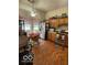 An eat-in kitchen showcasing stainless steel appliances, laminate countertops, and hardwood floors at 8457 Kousa Dr, Indianapolis, IN 46234