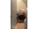 Cozy laundry room features tile flooring and modern washer and dryer, creating a functional space at 8457 Kousa Dr, Indianapolis, IN 46234