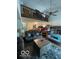 Open living room with vaulted ceilings, wood-burning fireplace, and abundant natural light at 8457 Kousa Dr, Indianapolis, IN 46234