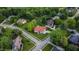 Aerial view of landscaped property with brick home and manicured lawn at 8703 Gordonshire Dr, Indianapolis, IN 46278
