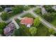 Aerial view of landscaped property with brick home and manicured lawn at 8703 Gordonshire Dr, Indianapolis, IN 46278