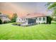 Expansive backyard with patio seating area and lush green lawn at 8703 Gordonshire Dr, Indianapolis, IN 46278