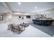 Finished basement with wet bar, recessed lighting, seating, and modern decor at 8703 Gordonshire Dr, Indianapolis, IN 46278