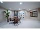 Basement sitting area with plants, pictures and decor at 8703 Gordonshire Dr, Indianapolis, IN 46278