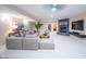 Spacious basement with seating area, fireplace, tv and modern decor at 8703 Gordonshire Dr, Indianapolis, IN 46278