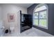 Modern bathroom featuring a black tiled shower, a large window, and a modern commode at 8703 Gordonshire Dr, Indianapolis, IN 46278
