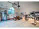 Clean, organized garage with storage racks and a new lawn mower at 8703 Gordonshire Dr, Indianapolis, IN 46278