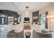 Open-concept living room with contemporary decor, fireplace, and bright lighting at 8703 Gordonshire Dr, Indianapolis, IN 46278