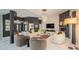 Modern living room with fireplace, stylish seating, and abundant natural light at 8703 Gordonshire Dr, Indianapolis, IN 46278