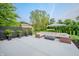 Inviting patio area featuring comfortable seating, a modern fire pit, and manicured greenery at 8703 Gordonshire Dr, Indianapolis, IN 46278