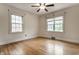 Cozy bedroom with hardwood floors and natural light from two windows at 948 N Layman Ave, Indianapolis, IN 46219