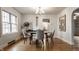 Bright dining room with modern furniture, hardwood floors, and ample natural light at 948 N Layman Ave, Indianapolis, IN 46219