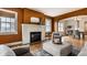 Inviting living room with a white brick fireplace, hardwood floors, and comfortable seating arrangements at 948 N Layman Ave, Indianapolis, IN 46219