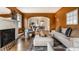 Open-concept living room flowing into a dining area, featuring hardwood floors and modern decor at 948 N Layman Ave, Indianapolis, IN 46219