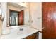 Bathroom with sink, vanity, and framed mirror at 9608 Sycamore Rd, Carmel, IN 46032