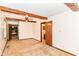 Bedroom boasting beamed ceilings and carpet flooring, with a view into an en-suite bathroom and living room at 9608 Sycamore Rd, Carmel, IN 46032