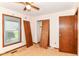 Bedroom with window and ceiling fan fixture at 9608 Sycamore Rd, Carmel, IN 46032