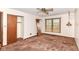 Bedroom with window and ceiling fan fixture at 9608 Sycamore Rd, Carmel, IN 46032