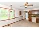 Cozy dining area featuring a ceiling fan, natural light, and seamless flow to the kitchen area at 9608 Sycamore Rd, Carmel, IN 46032