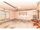 Garage showing exposed shelving, a window with blinds, and ample room for parking and storage at 9608 Sycamore Rd, Carmel, IN 46032