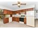 Functional kitchen with classic cabinets, appliances, and an open layout is ready for your design ideas at 9608 Sycamore Rd, Carmel, IN 46032