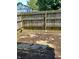 Backyard patio area enclosed by a wood fence offers a private outdoor space at 9794 Kingscross Ct, Indianapolis, IN 46235