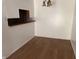 Bright dining room with open serving area and laminate wood flooring at 9794 Kingscross Ct, Indianapolis, IN 46235