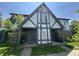 Two-story townhouse with light gray trim and covered entranceway with brick accents at 9794 Kingscross Ct, Indianapolis, IN 46235