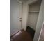 Hallway closet shows interior details including single shelf and floor mat at 9794 Kingscross Ct, Indianapolis, IN 46235