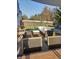 Inviting backyard patio with outdoor seating, grill, and mature trees, perfect for entertaining at 10197 Apple Blossom Cir, Fishers, IN 46038