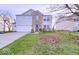 Charming two-story home featuring a brick facade and well-manicured lawn at 10197 Apple Blossom Cir, Fishers, IN 46038