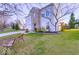 Beautiful home with lush green lawn, mature trees, and a cozy front porch at 10197 Apple Blossom Cir, Fishers, IN 46038