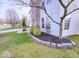 Close-up of landscaped front yard with healthy green bushes and mulch beds at 10197 Apple Blossom Cir, Fishers, IN 46038