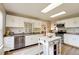 Bright and spacious kitchen with white cabinets, stainless steel appliances, and island at 10197 Apple Blossom Cir, Fishers, IN 46038