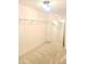 Spacious walk-in closet features neutral carpet, wire shelving, a full-length mirror, and overhead lighting at 10197 Apple Blossom Cir, Fishers, IN 46038