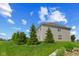 The backyard features lush green grass and well maintained trees at 1026 Sorrell Pass, Greenwood, IN 46143