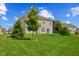Large backyard with vinyl siding on home and mature trees at 1026 Sorrell Pass, Greenwood, IN 46143