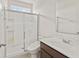 Clean bathroom with a shower and sliding glass door, toilet and vanity with mirror at 1026 Sorrell Pass, Greenwood, IN 46143