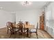 Well lit dining room with hardwood floors, long table and chairs and a hutch at 1026 Sorrell Pass, Greenwood, IN 46143