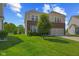 Spacious home featuring brick accents, siding, a two-car garage, and green lawn at 1026 Sorrell Pass, Greenwood, IN 46143