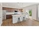 Modern kitchen with stainless steel appliances, dark cabinets, and a white countertop island at 1026 Sorrell Pass, Greenwood, IN 46143