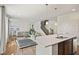 Open concept kitchen view with white countertop island, leading into a living room at 1026 Sorrell Pass, Greenwood, IN 46143