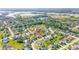 Aerial shot showcases the property in a neighborhood setting near a lake and Geist Riverside Park at 10555 Serra Vista Pt, Fishers, IN 46040