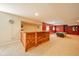 Finished basement with a custom wooden bar, a pool table, and stylish decor, ideal for entertainment at 10555 Serra Vista Pt, Fishers, IN 46040