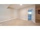 Spacious carpeted basement with neutral walls and an open doorway, perfect for a flexible living area at 10555 Serra Vista Pt, Fishers, IN 46040