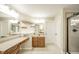 Bathroom features dual mirrors, vanity, walk-in shower, and tile flooring at 10555 Serra Vista Pt, Fishers, IN 46040