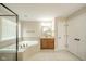 Bathroom boasts a soaking tub, walk-in shower, and vanity with ample counter space at 10555 Serra Vista Pt, Fishers, IN 46040