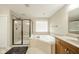 Bathroom features a walk-in shower, soaking tub, and a large vanity at 10555 Serra Vista Pt, Fishers, IN 46040