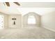 Bright, carpeted bedroom with vaulted ceiling and large window at 10555 Serra Vista Pt, Fishers, IN 46040
