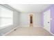 Bright bedroom with carpeted floors, neutral walls, and natural light from the window, perfect for relaxation at 10555 Serra Vista Pt, Fishers, IN 46040